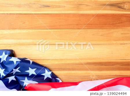 Top view with usa flag on wood table background. Top view with usa flag on wood table background. 139024494