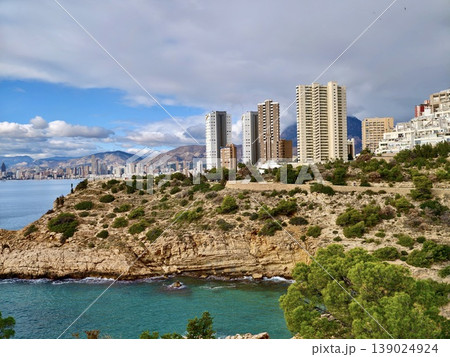 Modern Urban Structures Contrasting Vividly With Untouched Coastal Terrain Creating Vibrant Waterfront Scenery 139024924
