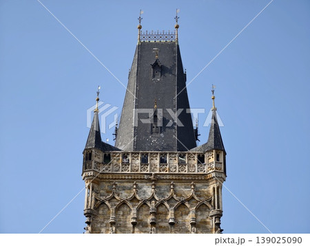 Vivid Sky Complements Buildings. Bright Blue Sky Emphasizes Detailed Gothic Structures Beautifully 139025090