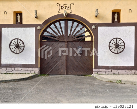 Vintage Rural Entrance. Traditional Country Gateway Showcasing Aged Wood And Classic Design Elements Vintage Rural Entrance. Traditional Country Gateway Showcasing Aged Wood And Classic Design Elements 139025121