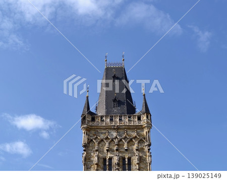 Elegant Stone Structure Features Reliefs. Ancient Gothic Spire With Artistic Sculptures And Intricate Designs 139025149