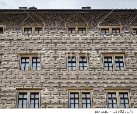 Architectural Facade With Windows. Facade Showcasing Geometric Relief And Rhythmic Window Placement 139025179