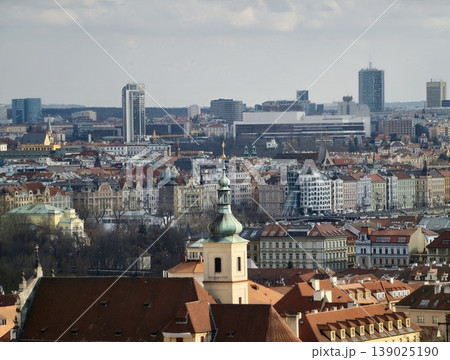Harmonious Blend Of Traditional Church Steeples And Towering Modern Buildings In Cityscape 139025190