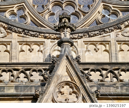Highly Detailed Gothic Building With Symmetrical Stone Relief And Elaborate Ornamental Carvings 139025197