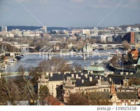 Cityscape With River. Morning View Of Historic City. Sunlit Panoramic Of Riverside Cityscape Cityscape With River. Morning View Of Historic City. Sunlit Panoramic Of Riverside Cityscape 139025216
