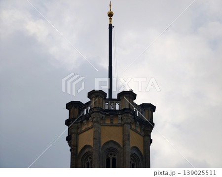 Detailed Spire Highlighted By Decorative Features And Atmospheric Sky For Architectural Showcases Detailed Spire Highlighted By Decorative Features And Atmospheric Sky For Architectural Showcases 139025511