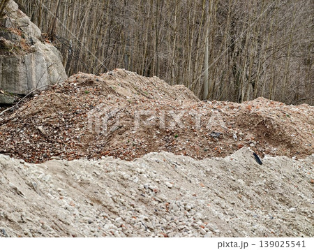 Construction Site Landscape. Abandoned Construction Yard With Spoil Heaps And Natural Surroundings 139025541