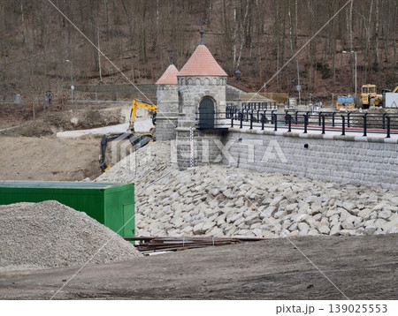 Dam Construction Progressing. Construction Site With Machinery Improving Flood Defenses And Infrastructure Dam Construction Progressing. Construction Site With Machinery Improving Flood Defenses And Infrastructure 139025553