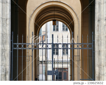 Stylized Iron Gateway Showcasing Detailed Masonry And Dramatic Shadow Play For Urban Photography Stylized Iron Gateway Showcasing Detailed Masonry And Dramatic Shadow Play For Urban Photography 139025632
