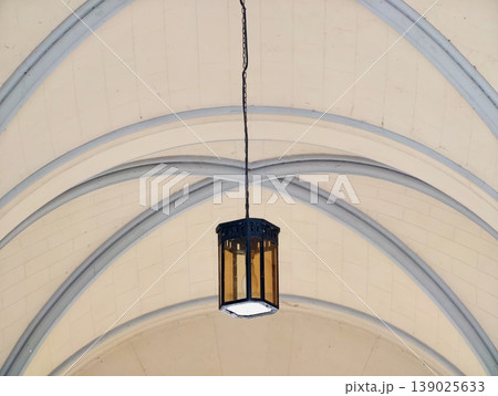 Photographic Scene Of Hanging Lantern With Symmetrical Arches And Visible Cracks In Plaster Ribs Photographic Scene Of Hanging Lantern With Symmetrical Arches And Visible Cracks In Plaster Ribs 139025633