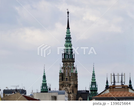 Green Spires And Copper Accents. Heritage Monument With Verdigris Details And Ceremonial Silhouette Green Spires And Copper Accents. Heritage Monument With Verdigris Details And Ceremonial Silhouette 139025664
