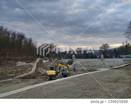 Crawler Excavator Transforming River Course Adjacent To Woodland For Ecological Rehabilitation Purposes Crawler Excavator Transforming River Course Adjacent To Woodland For Ecological Rehabilitation Purposes 139025699