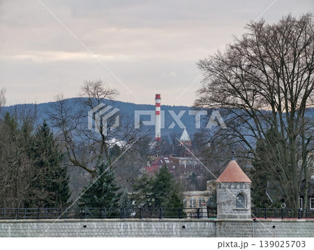 Misty Industrial Landscape. Serene Winter Riverfront Scene. Foggy Town With Factory And Historical Buildings Misty Industrial Landscape. Serene Winter Riverfront Scene. Foggy Town With Factory And Historical Buildings 139025703
