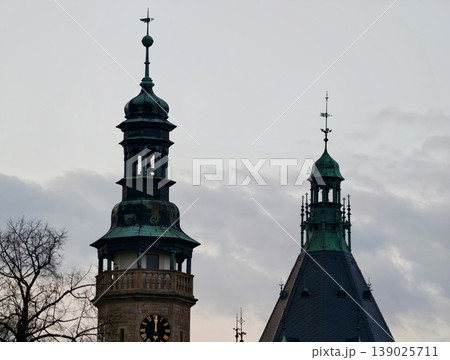 Majestic Twin Structures Featuring Green Spires And Detailed Copper Accents In Vertical Skyline View Majestic Twin Structures Featuring Green Spires And Detailed Copper Accents In Vertical Skyline View 139025711
