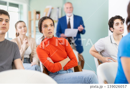 Female student listens attentively to a lecture 139026057