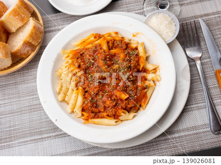 Pasta bolognese with cheese served on platter Pasta bolognese with cheese served on platter 139026081