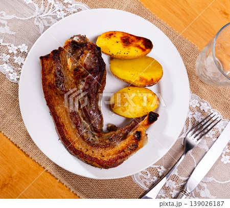 Fried beef meat served with fried potato served at plate Fried beef meat served with fried potato served at plate 139026187