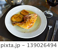 Chicken thigh with golden crust and stewed eggplant 139026494
