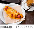 Fresh croissant or sandwich with sausage and coffee cup 139026520