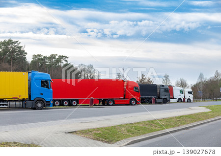 Colorful Cargo Trucks Parked in Row Logistics Transport Industry Shipping Fleet Colorful Cargo Trucks Parked in Row Logistics Transport Industry Shipping Fleet 139027678