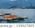 Luxury Wooden Motor Boats Moored at Pier on Scenic Mountain Lake 139027805
