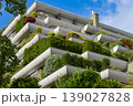 Modern Green Residential Building with Lush Terrace Garden and Sustainable Urban Architecture 139027828