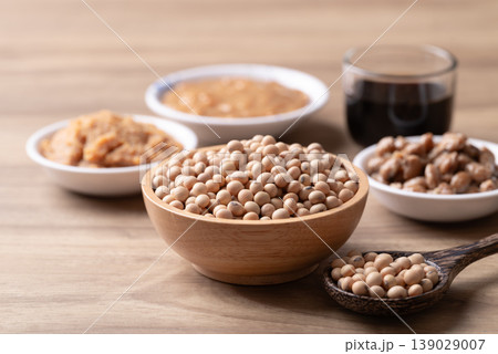 Assorted soy products: miso paste, natto, soy sauce and fermented soybean paste on wooden background Assorted soy products: miso paste, natto, soy sauce and fermented soybean paste on wooden background 139029007