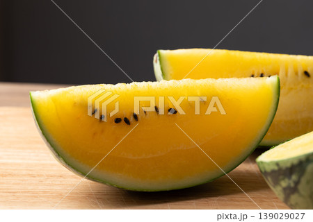 Sliced yellow watermelon on wooden background ready for eat Sliced yellow watermelon on wooden background ready for eat 139029027