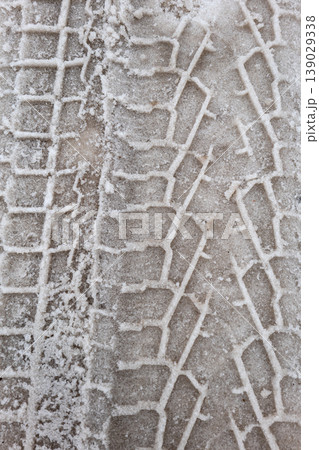 Snow Tire Track Pattern on Icy Ground Winter Texture Background 139029338