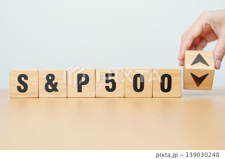 Hand change wooden block of SP500 text to UP and Down arrow symbol icon. stock market index, trade, trade company in the United States, financial growth and Cut loss concept 139030248