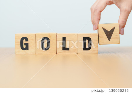 Hand change wood cube block with GOLD text to UP and Down arrow symbol icon.price, down and up, decrease and increase, cut loss, stocks, financial and economic concept Hand change wood cube block with GOLD text to UP and Down arrow symbol icon.price, down and up, decrease and increase, cut loss, stocks, financial and economic concept 139030253
