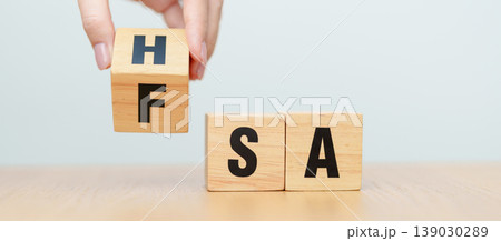 hand change wooden block from FSA to HSA. Flexible Spending Account and Health Savings Account, Medical Expenses, Tax Benefits and healthcare concepts hand change wooden block from FSA to HSA. Flexible Spending Account and Health Savings Account, Medical Expenses, Tax Benefits and healthcare concepts 139030289