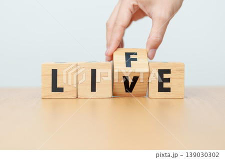 hand change wooden block Live to Life. Lifestyle, Live your life, learning, motivation and mindset concepts hand change wooden block Live to Life. Lifestyle, Live your life, learning, motivation and mindset concepts 139030302