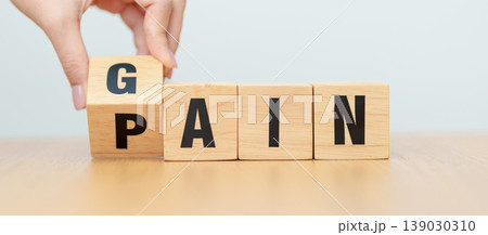 hand change wooden block Pain to Gain. solution and Value, Mindset for growth business, No Pain No Gain, Work hard, Motivation, Fitness, health, wellness and challenge concepts hand change wooden block Pain to Gain. solution and Value, Mindset for growth business, No Pain No Gain, Work hard, Motivation, Fitness, health, wellness and challenge concepts 139030310