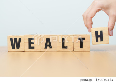 wooden block Wealth. Investment, Healthcare, Insurance, wellness, wellbeing and Work Life Balance concept wooden block Wealth. Investment, Healthcare, Insurance, wellness, wellbeing and Work Life Balance concept 139030313