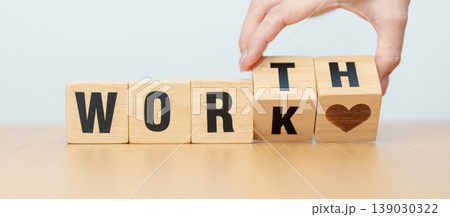 hand change wooden block Work to Worth. Know your worth concept hand change wooden block Work to Worth. Know your worth concept 139030322