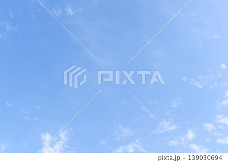 beautiful blue sky and white fluffy group of clouds with sunrise in the morning, natural background beautiful blue sky and white fluffy group of clouds with sunrise in the morning, natural background 139030694