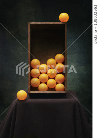 Still life with orange balloons and a wooden box Still life with orange balloons and a wooden box 139032963