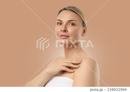 A confident woman poses, highlighting her radiant complexion 139032994