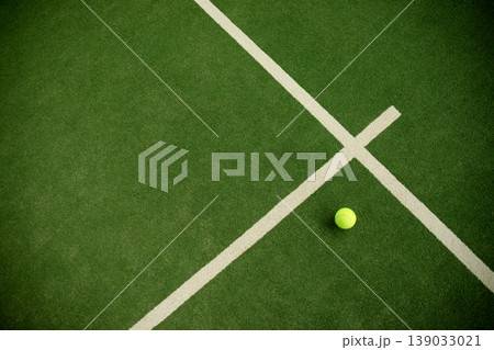 Padel ball rests on the court waiting for the match to start Padel ball rests on the court waiting for the match to start 139033021