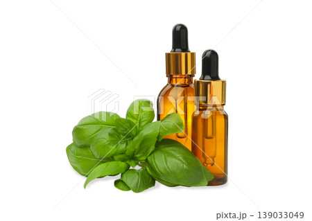 Basil leaves with two dropper bottles nearby for aroma, PNG 139033049