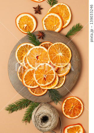 Dried orange slices are nicely placed on a round plate 139033246