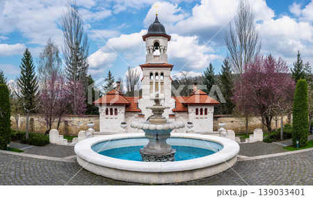 White Bell Tower and Stone Fountain at Curchi Monastery Grounds 139033401