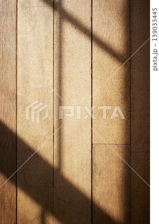 Natural Sunlight and Leaf Shadows on Window and Wooden Floor Background. Natural Sunlight and Leaf Shadows on Window and Wooden Floor Background. 139033445