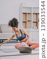 Women exercising in fitness studio yoga classes 139033544