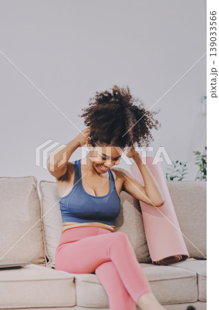 Women exercising in fitness studio yoga classes Women exercising in fitness studio yoga classes 139033566