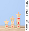 Wooden blocks with word win and wooden stars. Concept of collaboration and partnership leading to success. Strategy and business concept 139033607