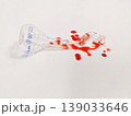 A shattered flask and spilled liquid create a dramatic visual, possibly representing a science experiment gone wrong 139033646