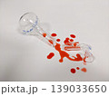 A shattered flask and spilled liquid suggest a science experiment gone wrong or a lab accident 139033650