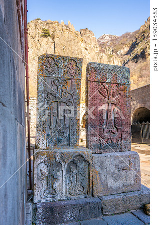 Stone carvings with religious symbols in a mountainous landscape Stone carvings with religious symbols in a mountainous landscape 139034383